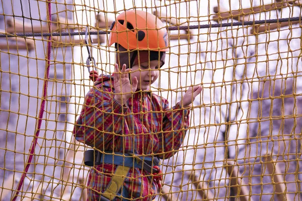 Boy playing on a rope bridge — Stock Photo, Image