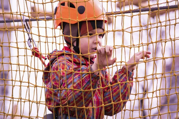 Boy playing on a rope bridge — Stock Photo, Image