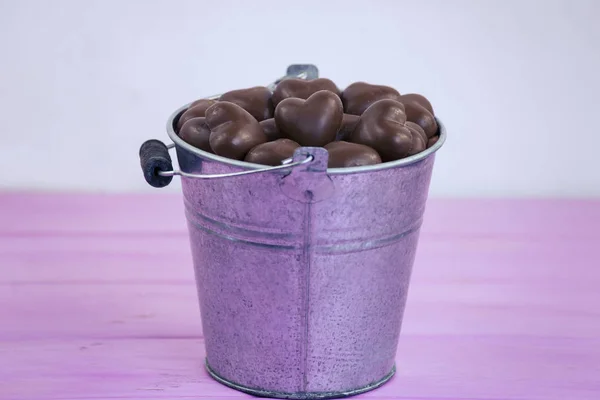 Background Iron Bucket Candies Heart Made Milk Chocolate — Stock Photo, Image