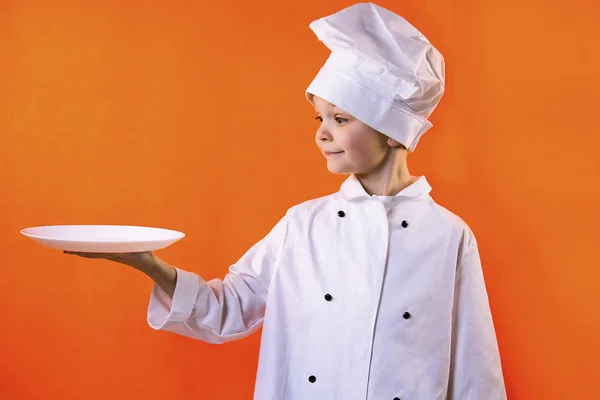 Funny Boy Chef Cook Holding Plate Dough Orange Background — Stock Photo, Image