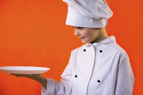 Funny Boy Chef Cook Holding Plate Dough Orange Background — Stock Photo, Image