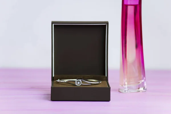 silver bracelet with a diamond in a box