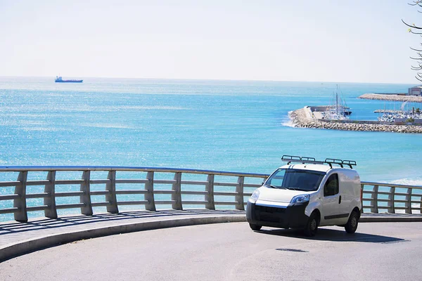 car rides on holiday on a bridge on the seashore Spain in spring