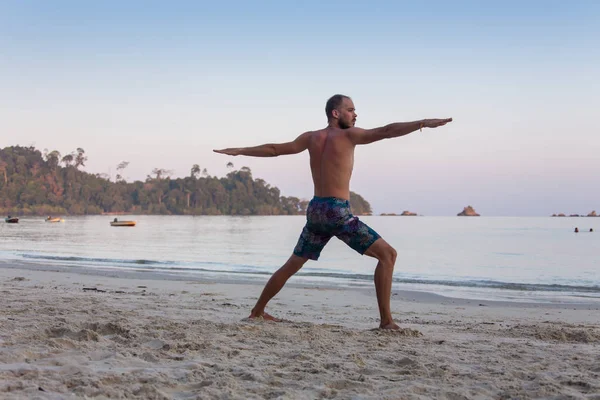 Portrait of an attractive young man on a tropical beach — Stock Photo, Image