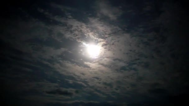 Full moon behind clouds at night — Stock Video