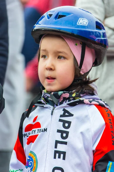 KAZAKHSTAN, ALMATY - JUNE 11, 2017: Childrens cycling competitions Tour de kids. Children aged 2 to 7 years compete in the stadium and receive prizes. Children at the solemn construction - waiting — Stock Photo, Image