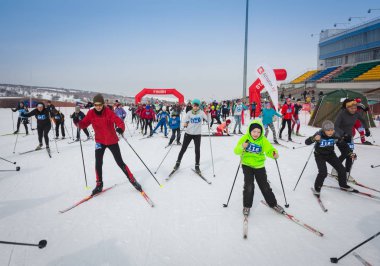 KAZAKHSTAN, ALMATY - FEBRUARY 25, 2018: Amateur cross-country skiing competitions of ARBA ski fest 2018. Participants from all over the republic competed for competitions and compete for medals. clipart