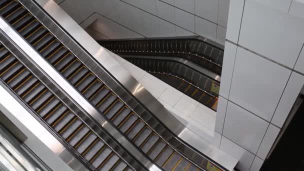 Close-up shot of empty moving staircase running up and down. Modern escalator stairs, which moves indoor. — Stock Video