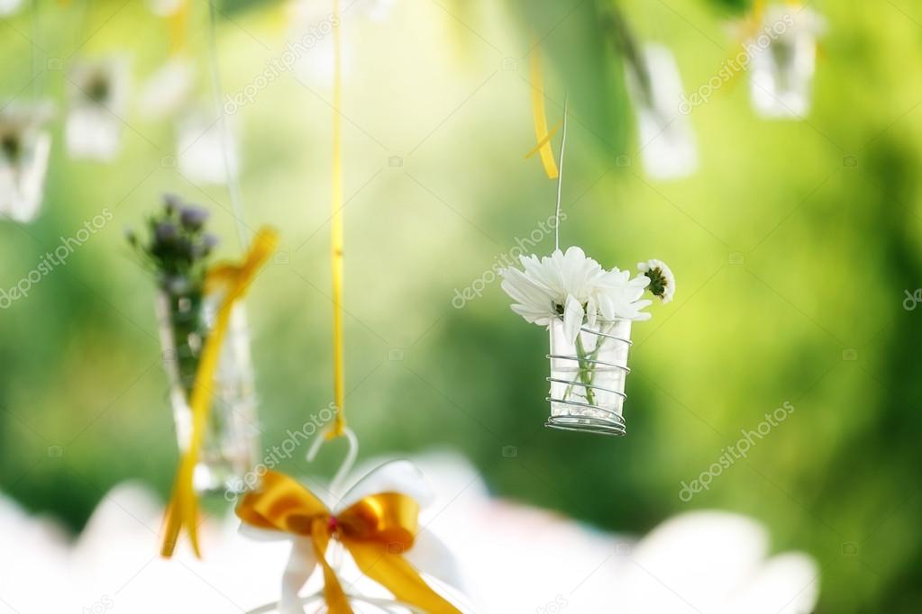 Beautiful flowers in the glass bucket. Decorated in celebration.