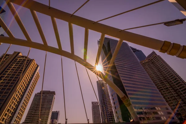 cityscape of modern office building & bridge at Chong Nonsi station of bts sky train mass transit system in Bangkok, Thailand