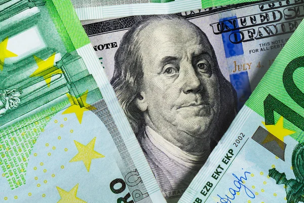 Dollar and euro banknotes close upExchange rates on the worlds stock exchanges, cross currency rates, Financial and economic news and forecasts. Currency speculation on the dollar euro exchange.