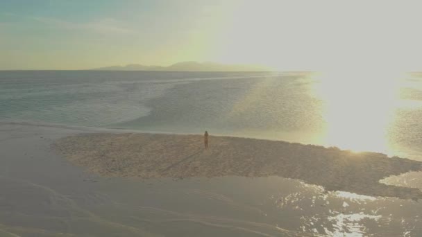 Cinematic Aerial View Woman Alone Isolated White Sandbar Onok Island — Stok Video