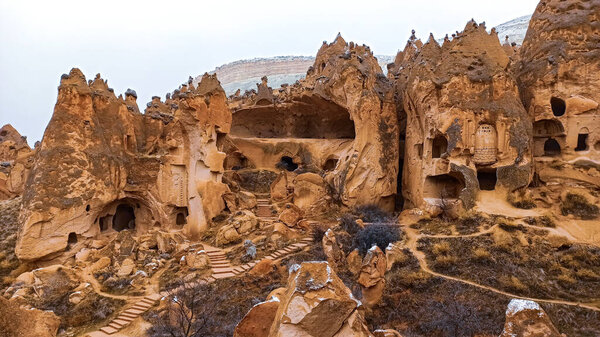 Cave houses and monasteries carved into Tufa Rocks at Zelve Open Air Museum (Zelve Valley) in winter season in Cappadocia, Turkey