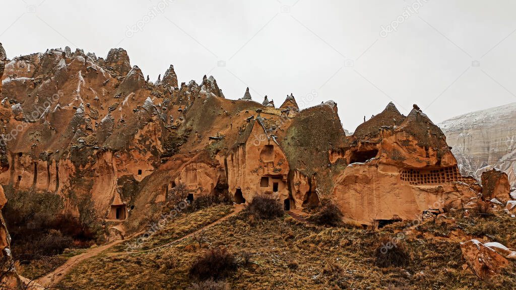 Cave houses and monasteries carved into Tufa Rocks at Zelve Open Air Museum (Zelve Valley) in winter season in Cappadocia, Turkey