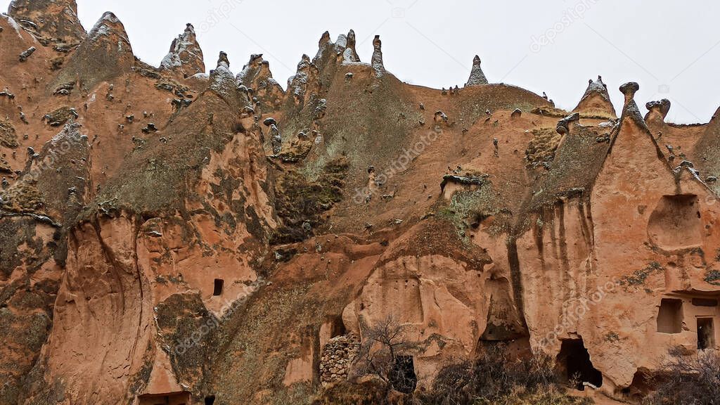 Cave houses and monasteries carved into Tufa Rocks at Zelve Open Air Museum (Zelve Valley) in winter season in Cappadocia, Turkey