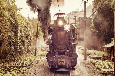 Steam narrow-gauge train. clipart