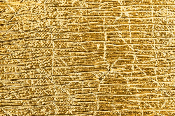 Goldene Folie abstrakt strukturierten Hintergrund. — Stockfoto