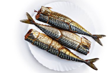 Three pieces of smoked scomber fish. clipart