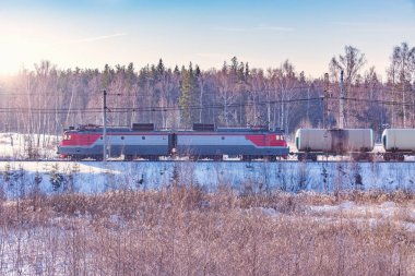Freight train at cold winter morning. clipart