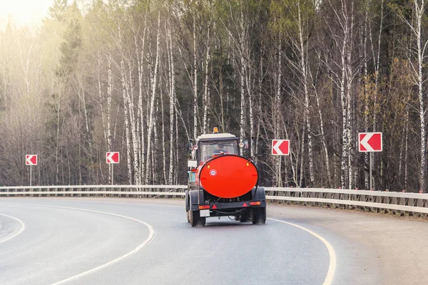 Watering machine on the road — Stock Photo, Image