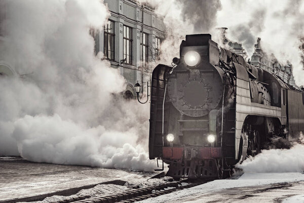 Steam train departs from Riga railway station. Moscow. Russia.