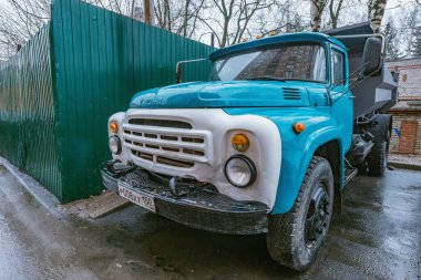 Korolev, Russia - March 03, 2020: Retro freight truck ZIL 130 on the rainy city street.