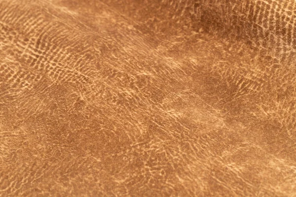 brown faux suede leather for the concept and style idea of fine leather craft, handmade work space. Background textures and Wallpapers.