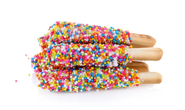 Ekmek sopa beyaz arka plan üzerinde renkli çikolata — Stok fotoğraf