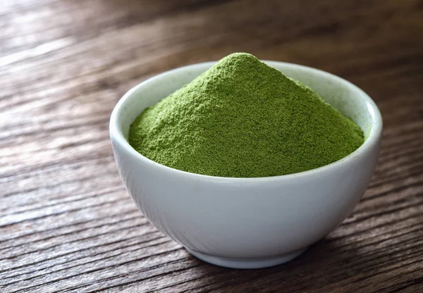 Green tea powder in cup