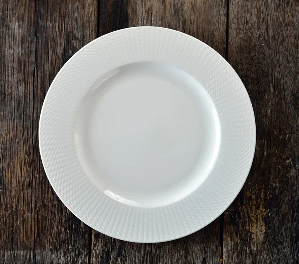 White plate on wooden — Stock Photo, Image