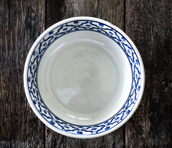 Empty white plate on wooden — Stock Photo, Image
