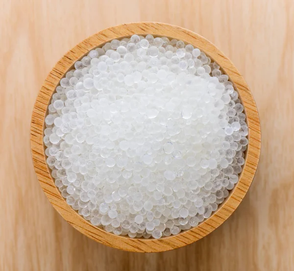 Silica gel in wood bowl — Stock Photo, Image