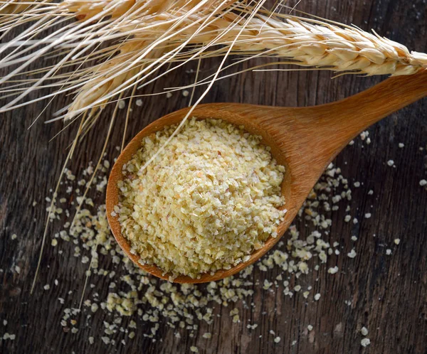 Wheat germ in wood spoon