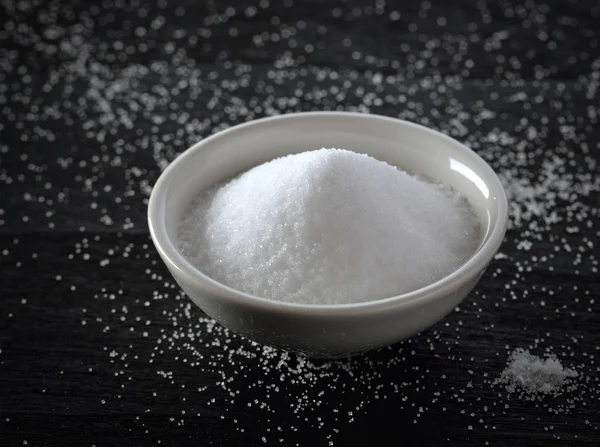 White salt on black background — Stock Photo, Image