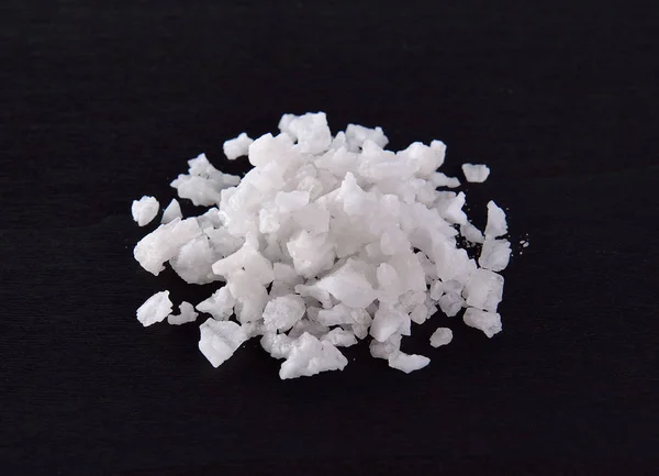 Salt in black wood — Stock Photo, Image