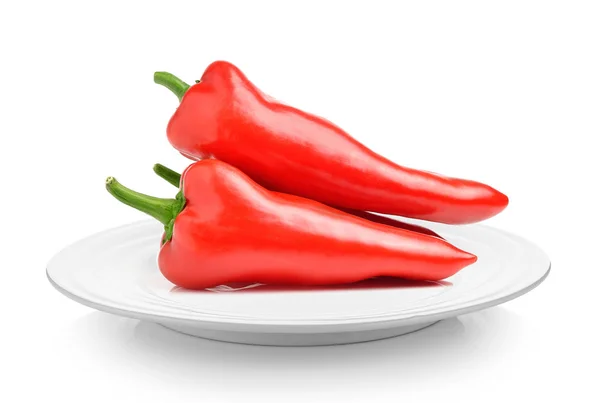 Red sweet pepper in plate on white background — Stock Photo, Image