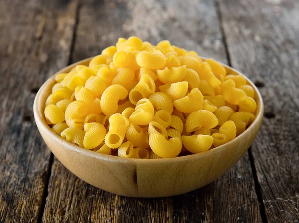 Macaroni in wood bowl — Stock Photo, Image