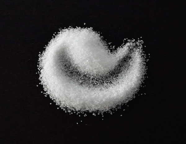 Salt on black table — Stock Photo, Image