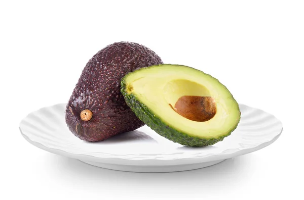 Avocado in white plate on white background — Stock Photo, Image