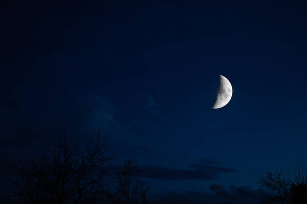 Half Moon Background. Night sky with stars and moon and clouds.