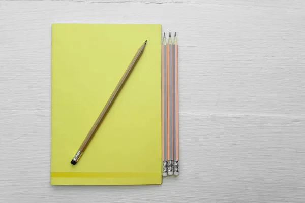 Overhead Yellow Notebook Blank Brown Pencil White Desk Background Right — Stock Photo, Image