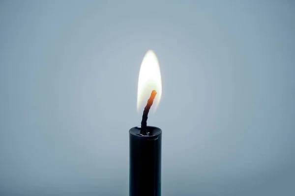 Closeup Candlelight Burning Stick Black Blue Background Copy Space — Stock Photo, Image