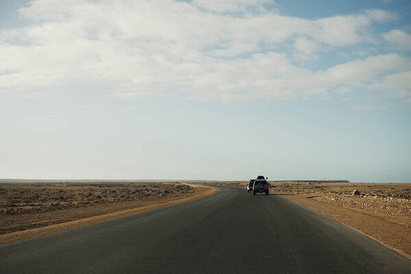 Morocco , Africa, January 18, 2020: Off road jeep is driving along the road at Africa