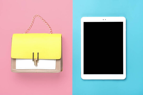 Leather handbag yellow, beige, white colors, tablet on pink and blue background Flat lay Top view Spring, summer, fashion, creative concept Black Friday Online order and delivery Mock up