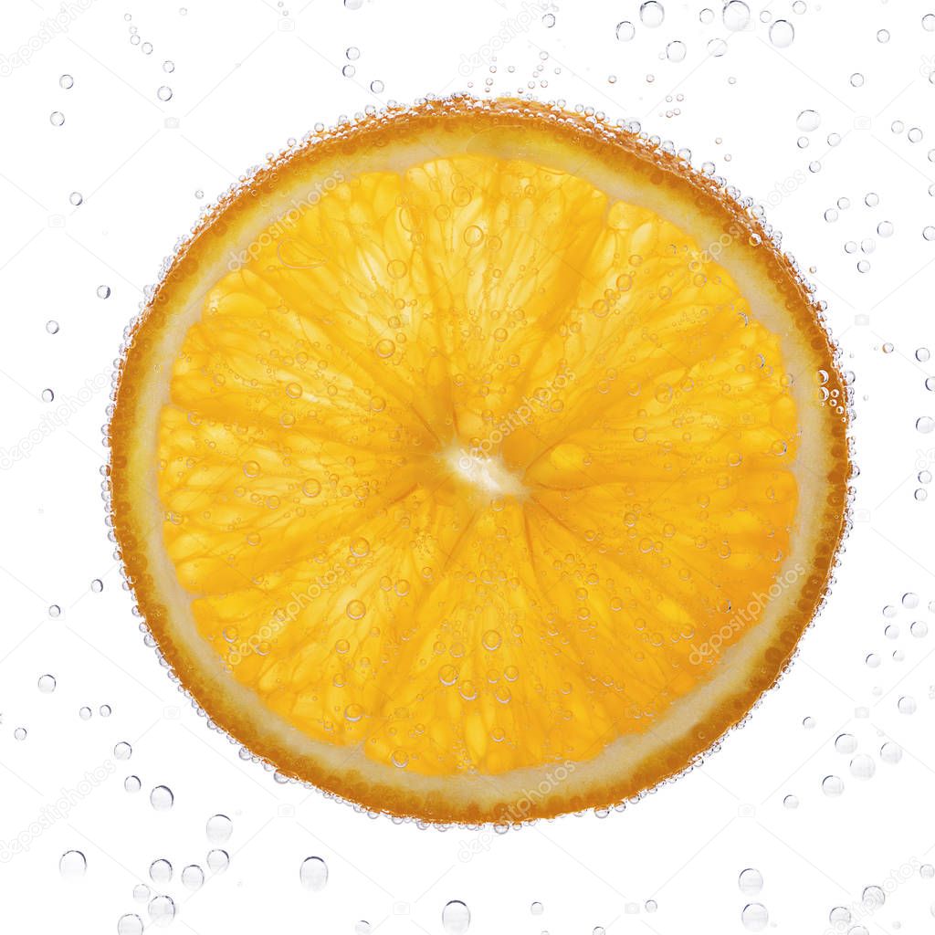 Orange slice with bubbles in water isolated on white background