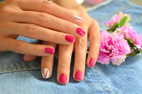 Manicure short red nails and white on the index finger — Stock Photo, Image