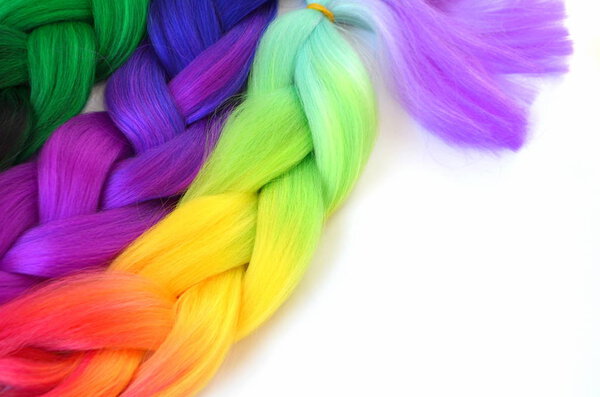 Kanekalon. Colored artificial strands of hair. Material for plaiting braids.