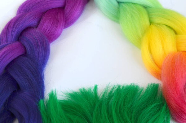 Kanekalon. Colored artificial strands of hair. Material for plaiting braids.