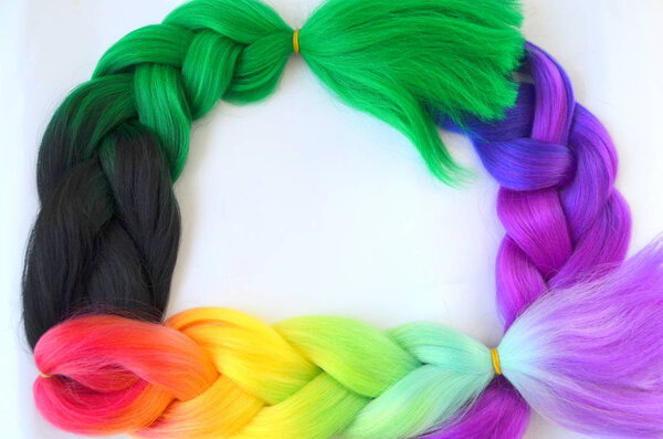 Kanekalon. Colored artificial strands of hair. Material for plaiting braids.