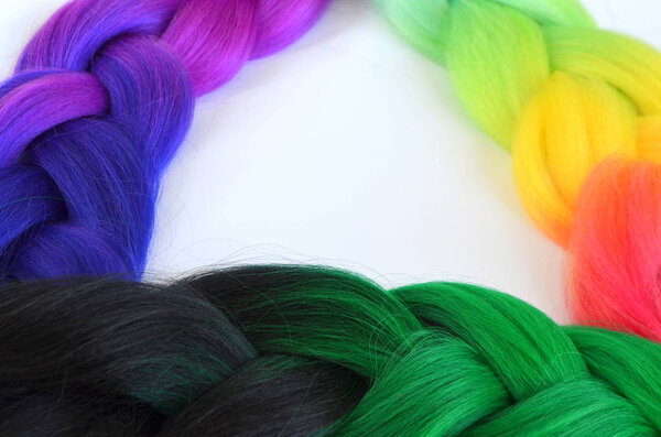 Kanekalon. Colored artificial strands of hair. Material for plaiting braids.